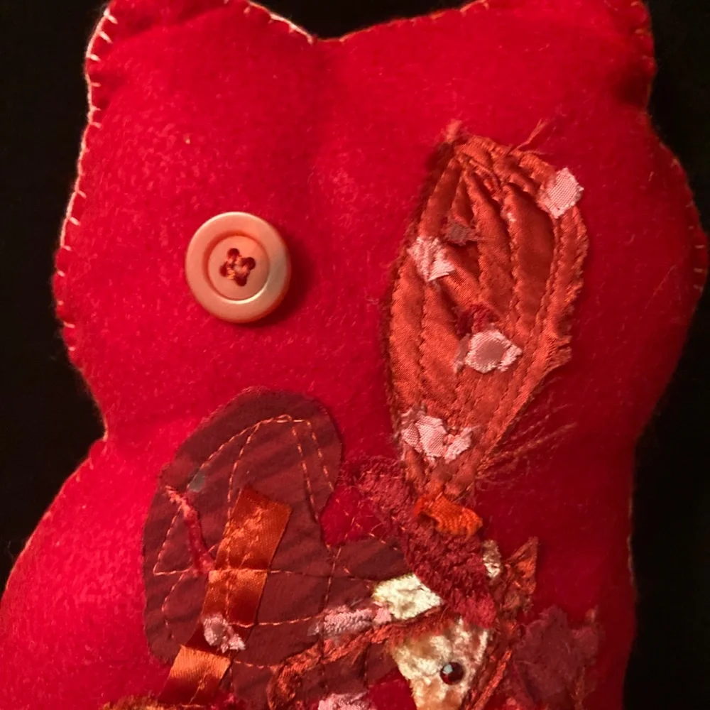 Valentine's small felt cat pillow. Vintage fabrics and button for an eye.